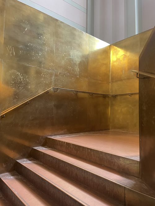 Image 18: View of the staircase walking up from ground level. Note the hand marks which give the staircase  a history of the patrons’ caresses on the brass surfaces. Photograph (author’s collection)