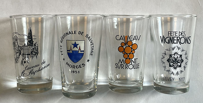 small white wine glasses featuring local wineries (author’s collection)